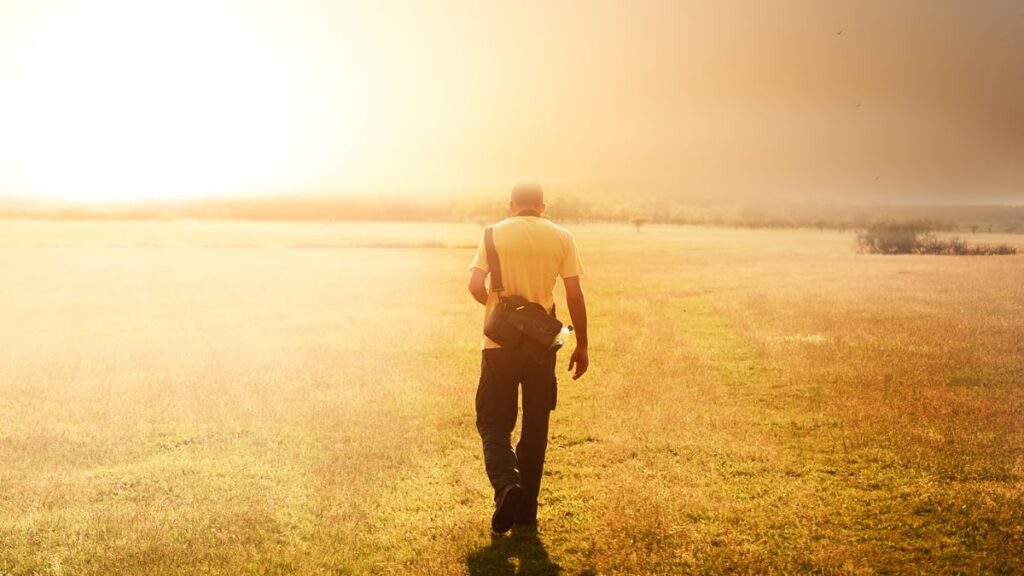 Man walking into sunlight symbolizing hope and shame-free sex education