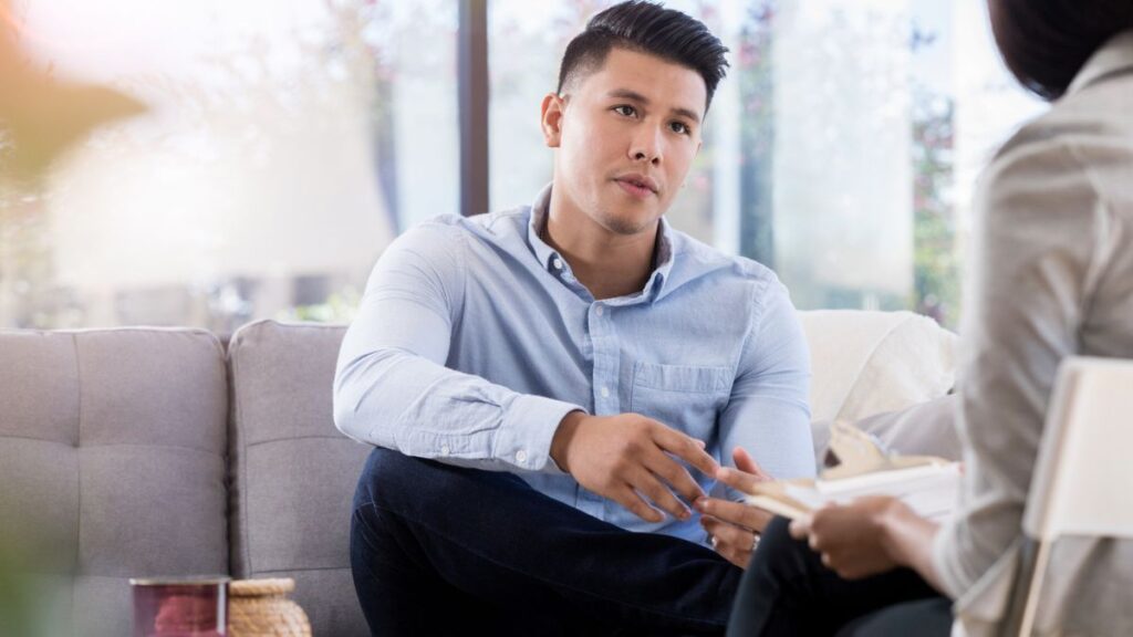 Therapist supporting man with erection anxiety through conversation