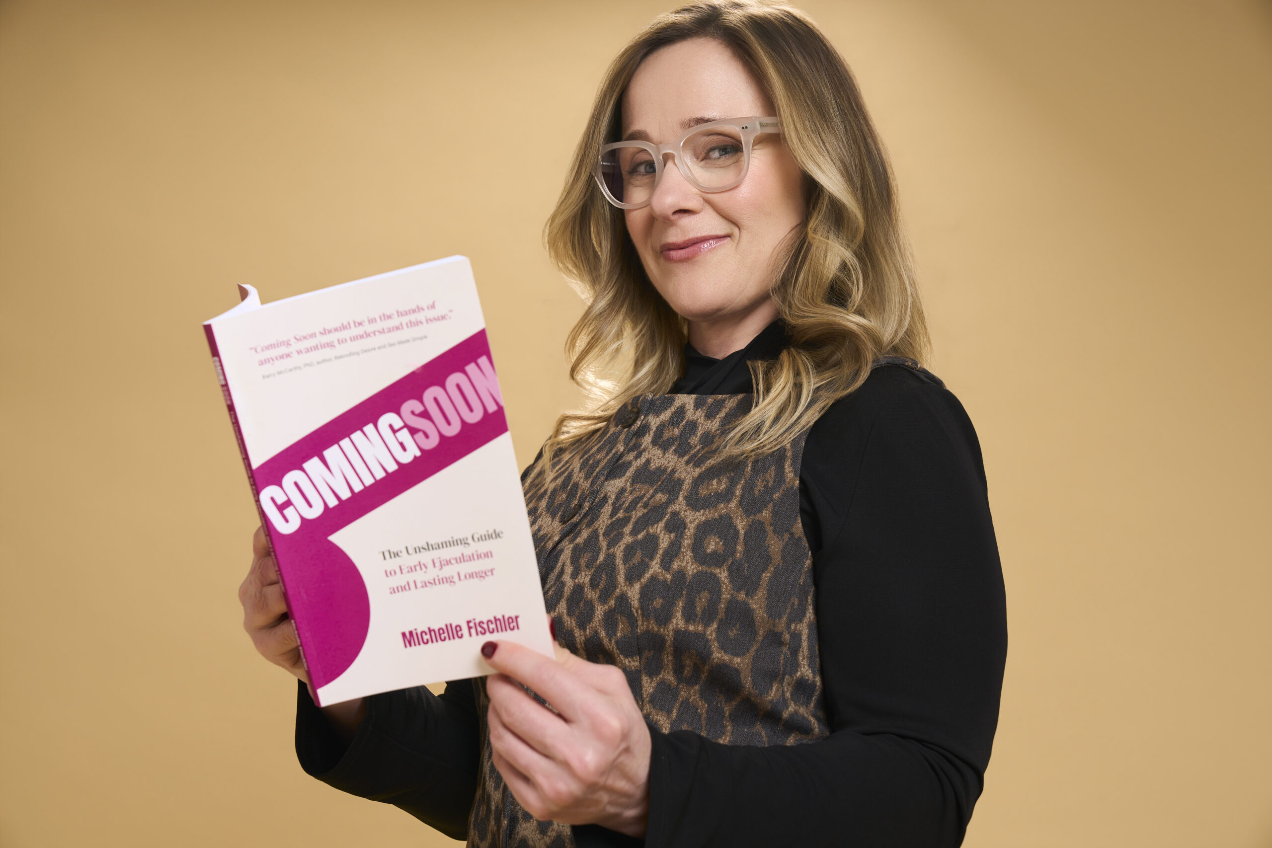 Michelle Fischler holding Coming Soon, the unshaming guide to premature ejaculation and early ejaculation