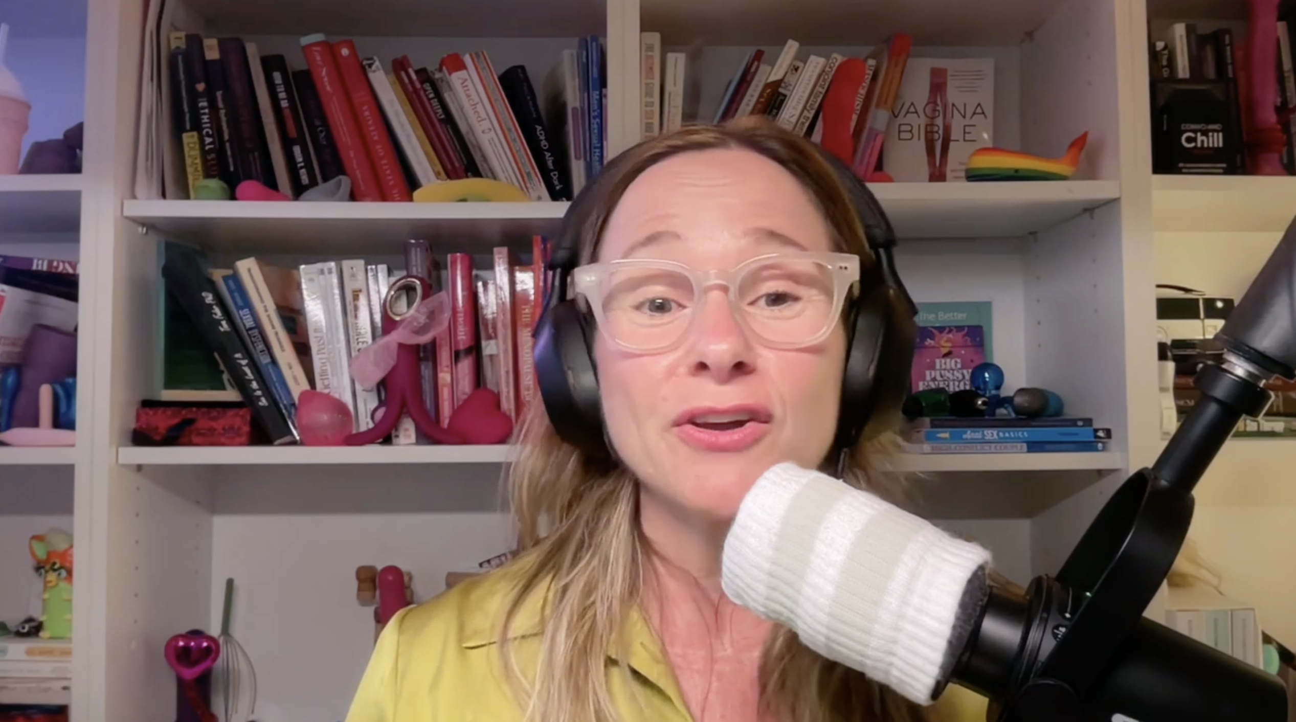 Michelle in front of podcast microphone talking about shame.