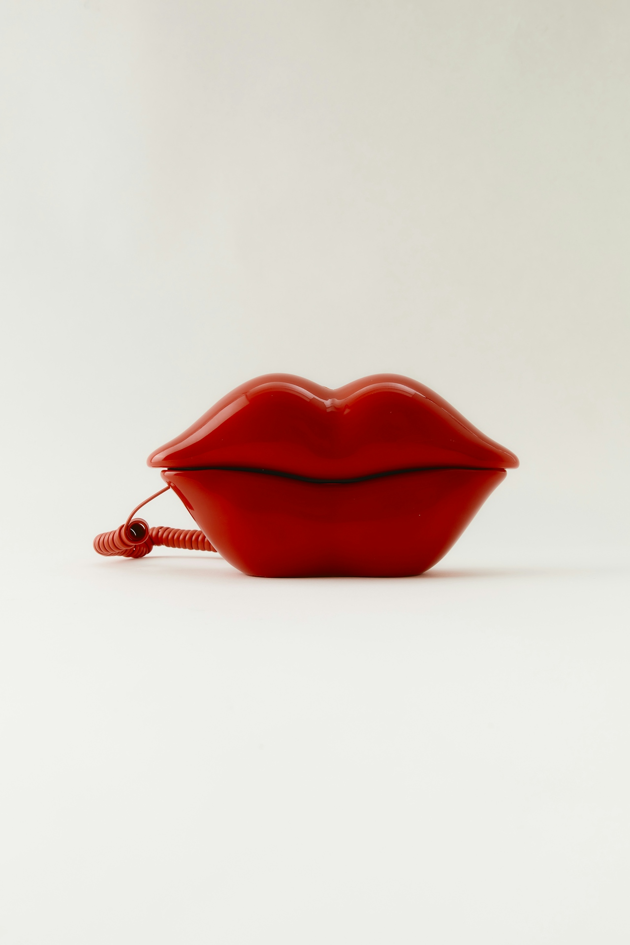 A photo of a phone shaped like lips for the featured image in GETSOME's Ask a Sex Therapist blog content.